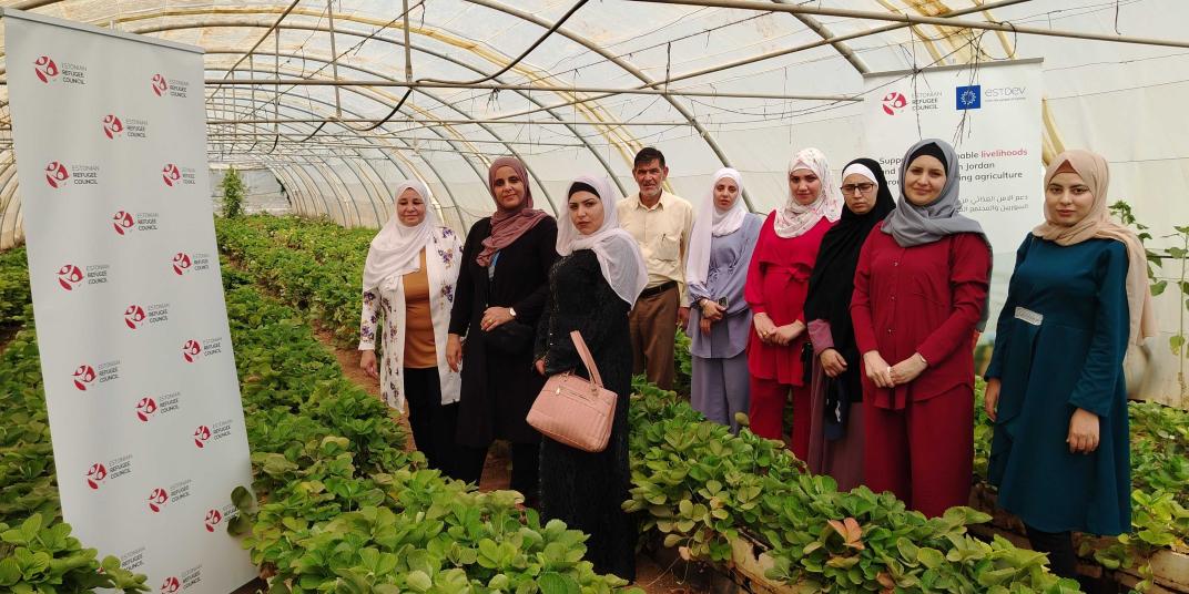Women standing in a hydroponic greenhouse 