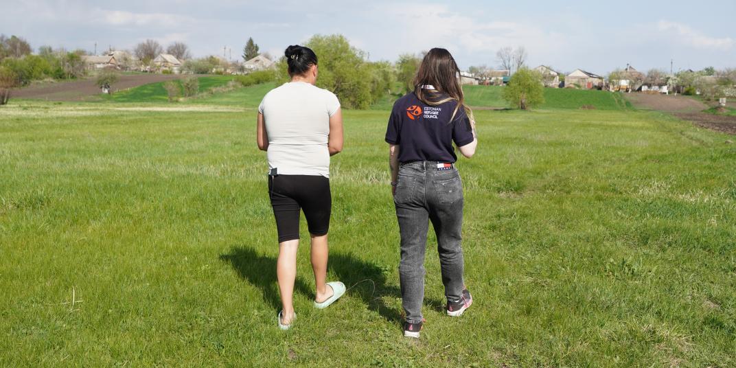 Alina, participant of the programme, shows ERC team a pasture
