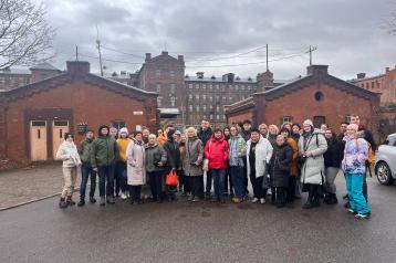 People standing infront of a building 